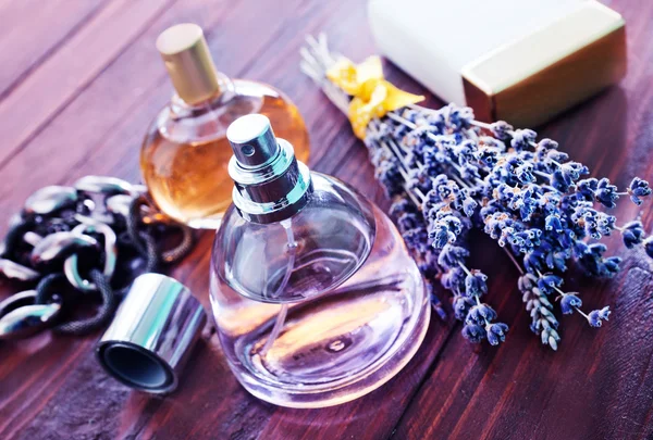 Perfumes in bottles on table — Stock Photo, Image