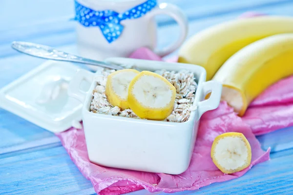 Oat flakes with banana — Stock Photo, Image