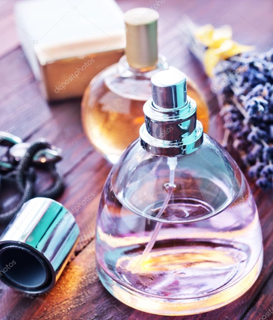 Perfumes in bottles on table