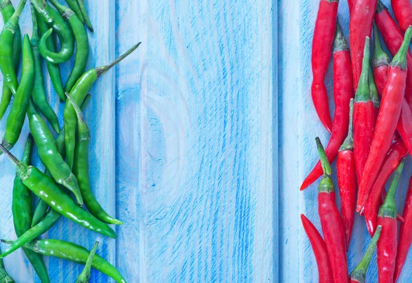 Chilli pepper on the blue background — Stock Photo, Image