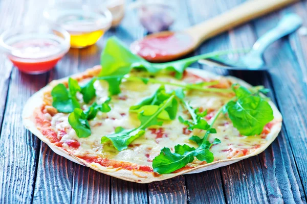 Fresh pizza on table — Stock Photo, Image
