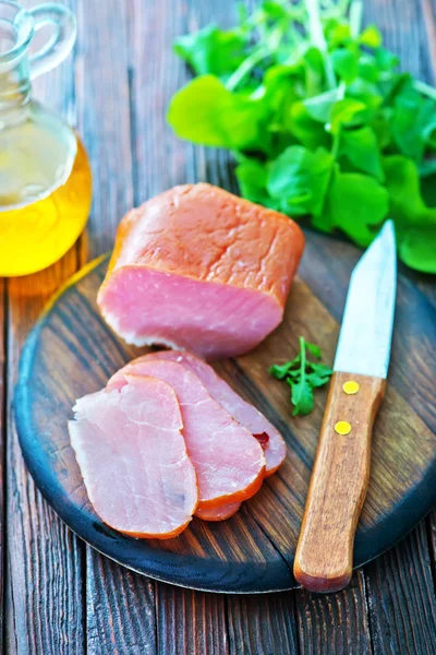 Smoked meat and knife — Stock Photo, Image