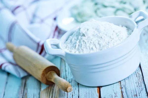 Flour in bowl and on table