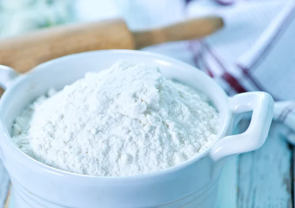 Flour in bowl and on table