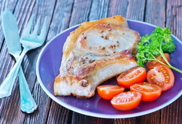 Fried steak with tomato — Stock Photo, Image