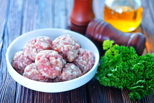 Raw meatballs on plate — Stock Photo, Image