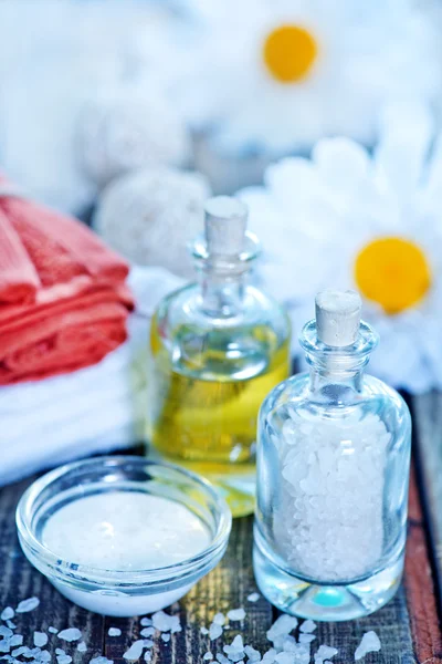 Sea salt and oil in bottles — Stock Photo, Image