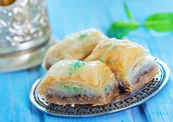 Baklava, Turkish dessert on metal plate — Stock Photo, Image