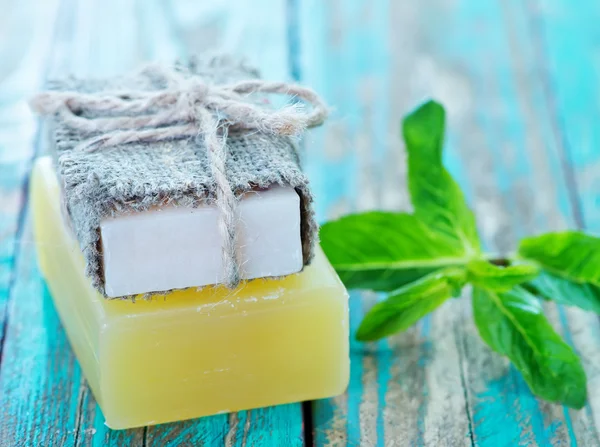 Soap and mint leaves — Stock Photo, Image