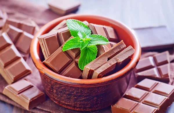 Tasty chocolate in bowl — Stock Photo, Image