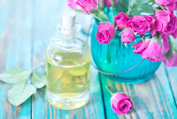 Rose oil in glass bottle — Stock Photo, Image