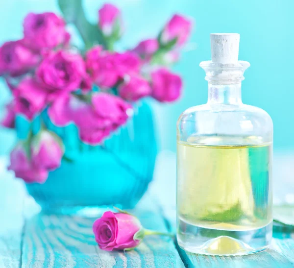 Rose oil in glass bottle — Stock Photo, Image