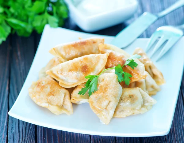 Fried dumplings on the white plate — Stock Photo, Image