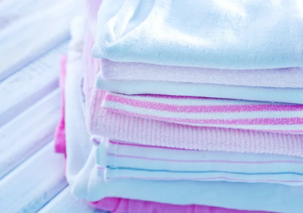 Baby clothes on a table — Stock Photo, Image