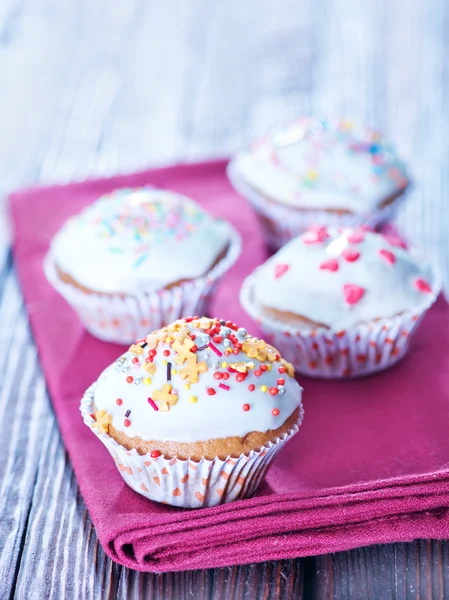 Muffins with color candy — Stock Photo, Image