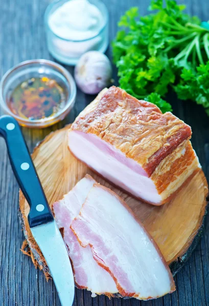 Smoked lard on wooden board — Stock Photo, Image