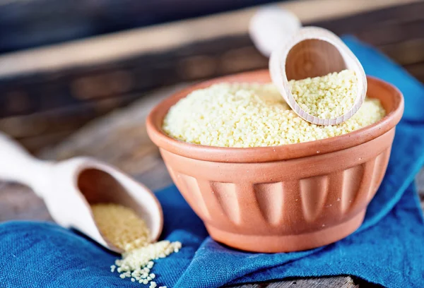 Cous-cous in bowl and on a table — Stock Image Cous-cous in bowl and on a table Stock Picture