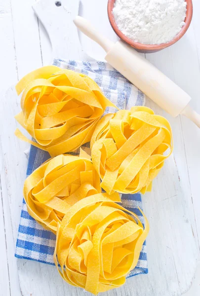 Raw pasta on napkin — Stock Photo, Image