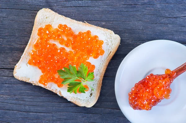 Bread with caviar on table — Stock Photo, Image