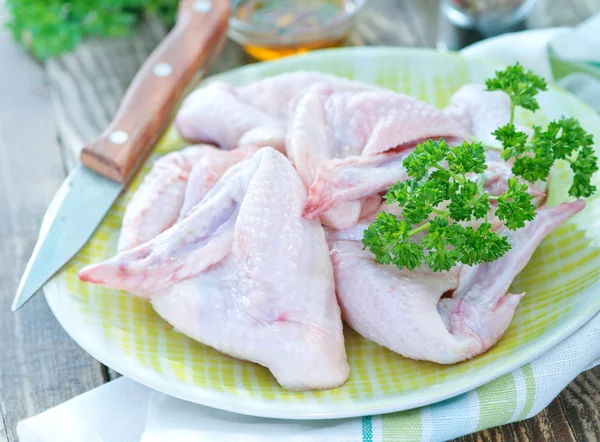 Raw chicken wings on plate — Stock Photo, Image