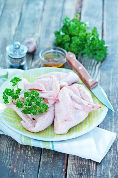 Raw chicken wings on plate — Stock Photo, Image