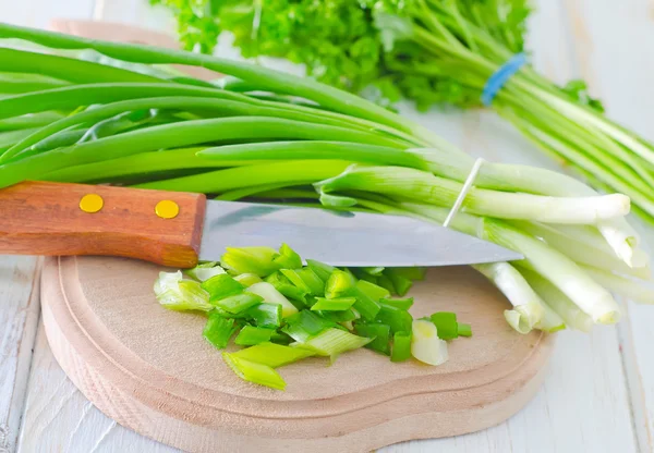 Fresh greens on wooden board — Stock Photo, Image