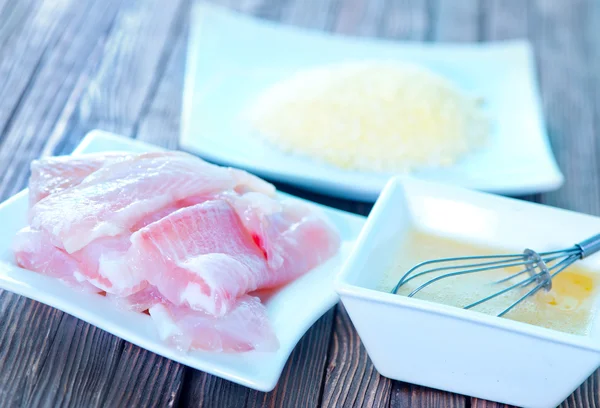 Flour, raw egg and raw fish — Stock Photo, Image