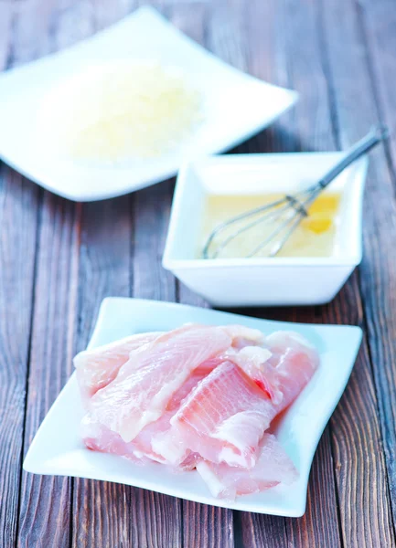 Flour, raw egg and raw fish — Stock Photo, Image