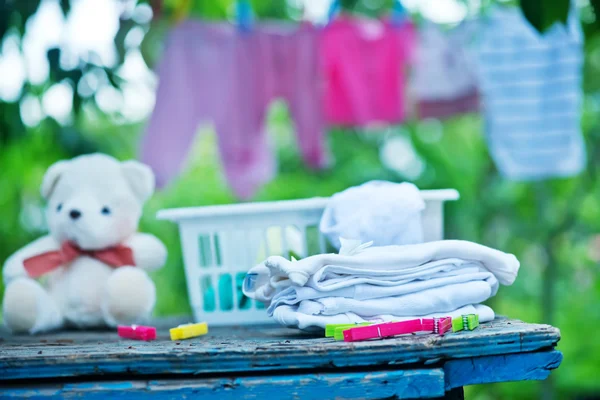 Baby clothes on rope — Stock Photo, Image