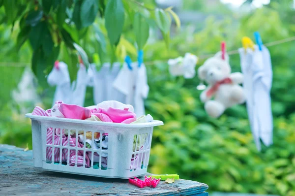 Baby clothes on rope — Stock Photo, Image