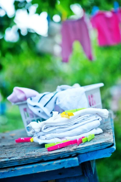 Baby clothes on rope — Stock Photo, Image