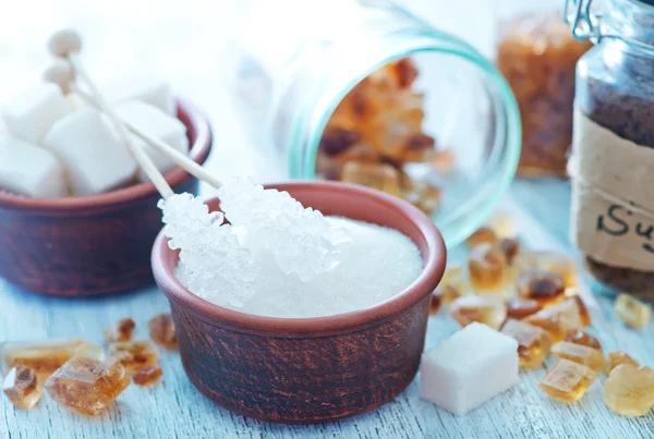 Sugar crystal on the wooden board — Stock Photo, Image