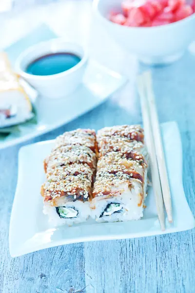 Fresh sushi rolls on plate — Stock Photo, Image