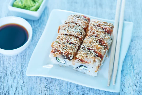 Fresh sushi rolls on plate — Stock Photo, Image