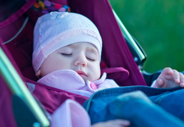 Baby girl in pram — Stock Photo, Image