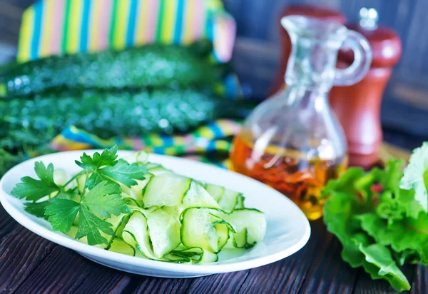 Cucumber salad on white plate — Stock Photo, Image