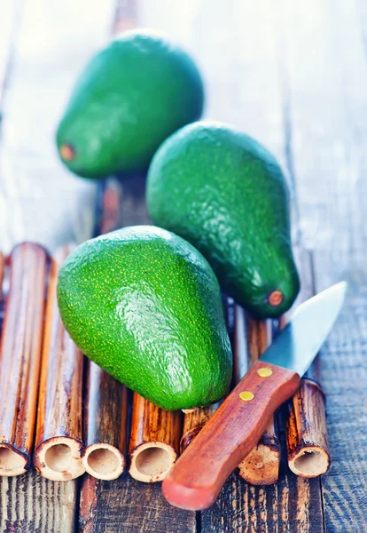 Fresh avocado on bamboo board — Stock Photo, Image