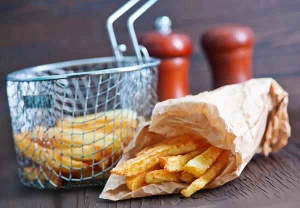 Fried potato in paper bag — Stock Photo, Image