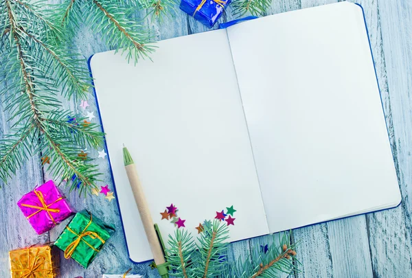 Notepad and christmas decoration — Stock Photo, Image