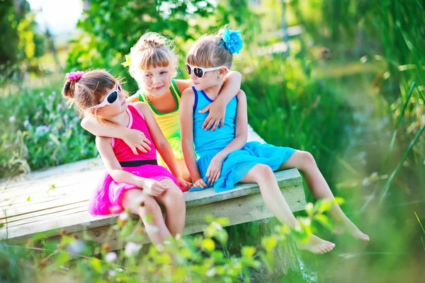 Cute sisters on pier — Stock Photo, Image