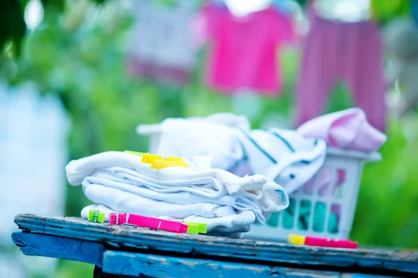 Baby clothes in garden — Stock Photo, Image