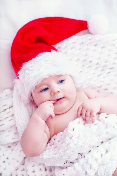 Baby in christmas hat Stock Image