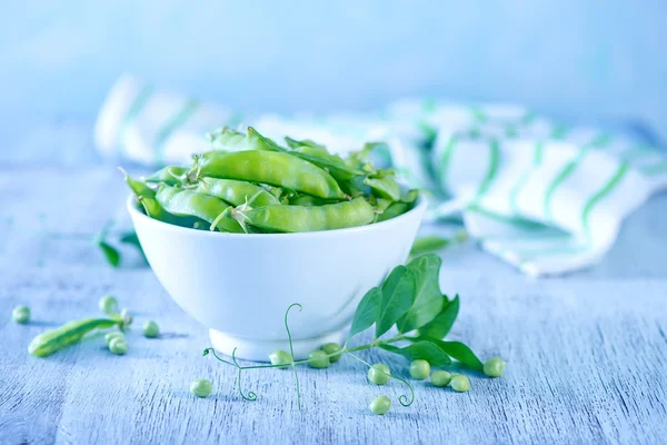 Green peas on bowl — Stock Photo, Image