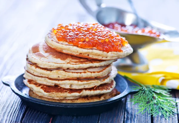 Pancakes with salmon caviar — Stock Photo, Image