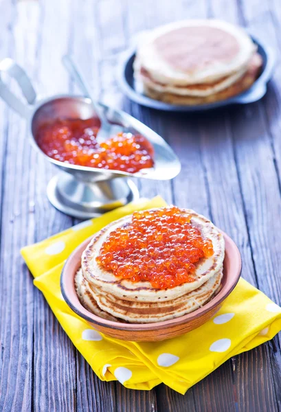 Pancakes with salmon caviar — Stock Photo, Image