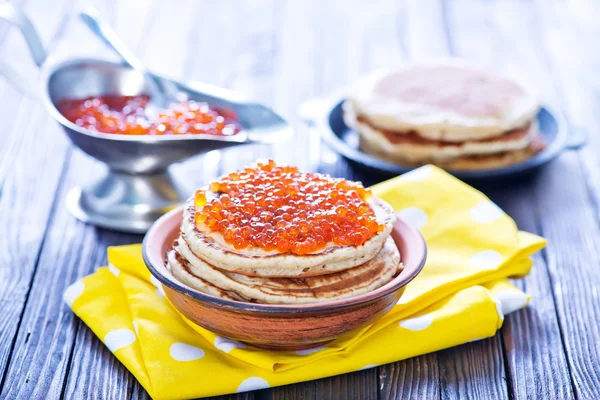 Pancakes with salmon caviar — Stock Photo, Image