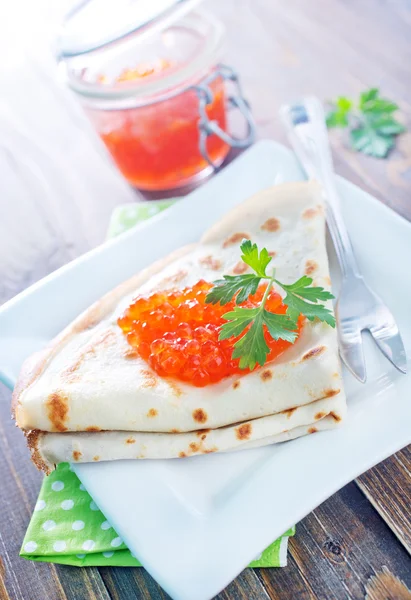 Pancakes with salmon caviar — Stock Photo, Image