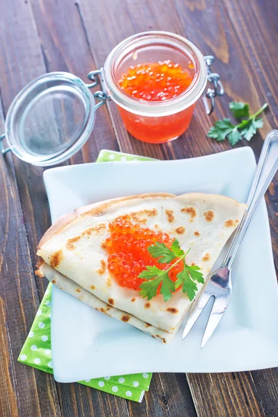 Pancakes with salmon caviar — Stock Photo, Image