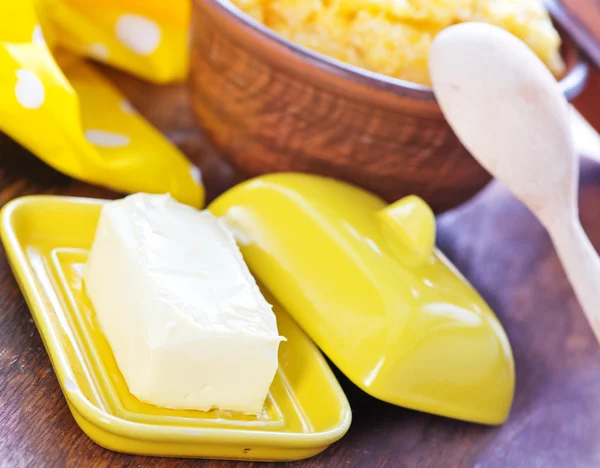 Corn porridge and butter — Stock Photo, Image