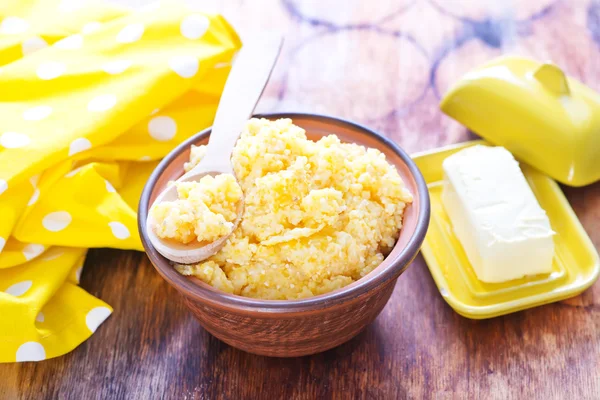 Corn porridge and butter — Stock Photo, Image